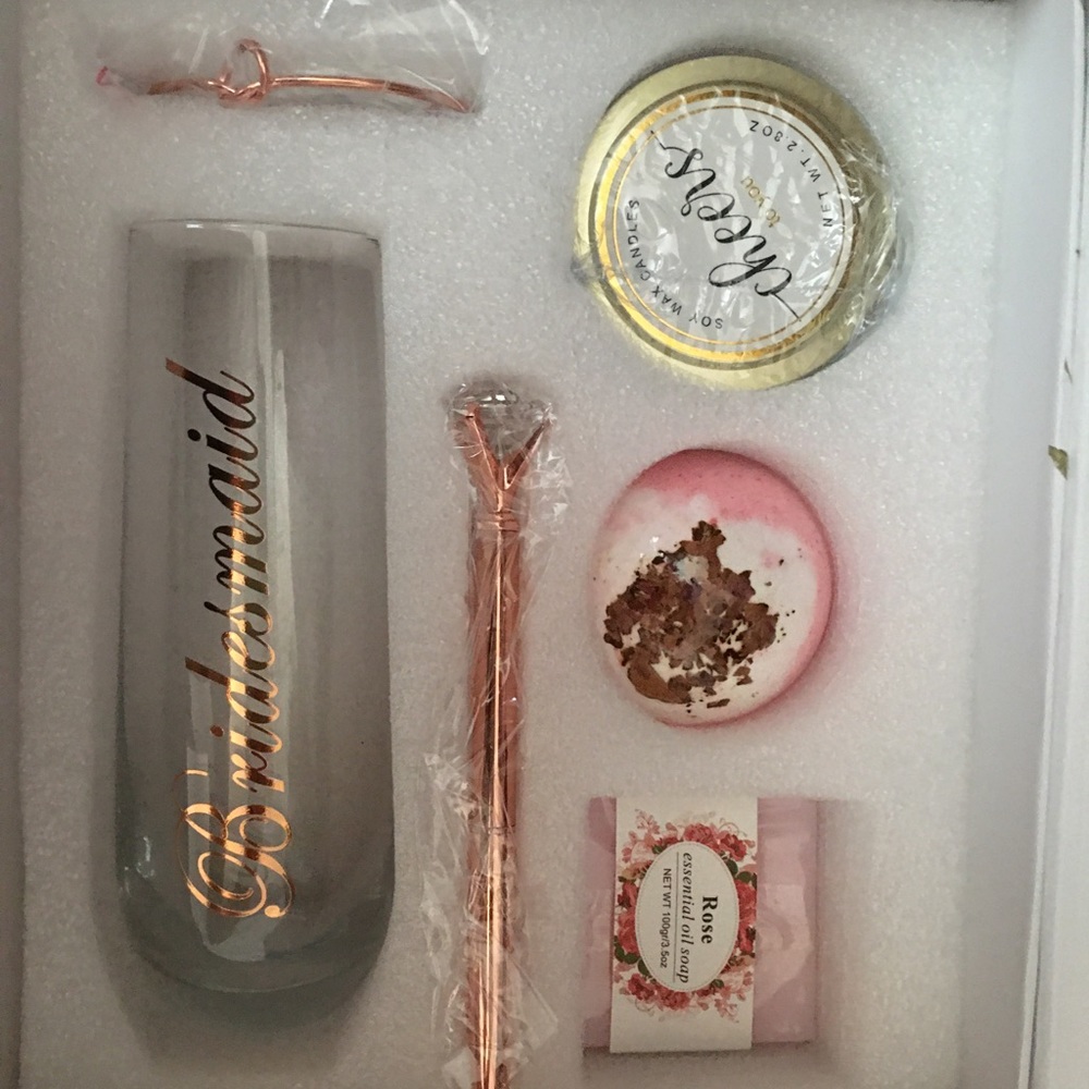 Bath soap, bath bomb, champagne flute glass, candle, scrunchie hair tie
